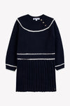 TARTINE ET CHOCOLAT LONG SLEEVE PLEATED DRESS WITH NECK BUTTONS AND WHITE TRIM