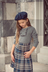 COCO BLANC 2PC RUFFLE BIB SWEATER WITH PLEATED PLAID SKIRT